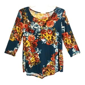 Exclusive One women's med floral print polyester pullover top. 6074